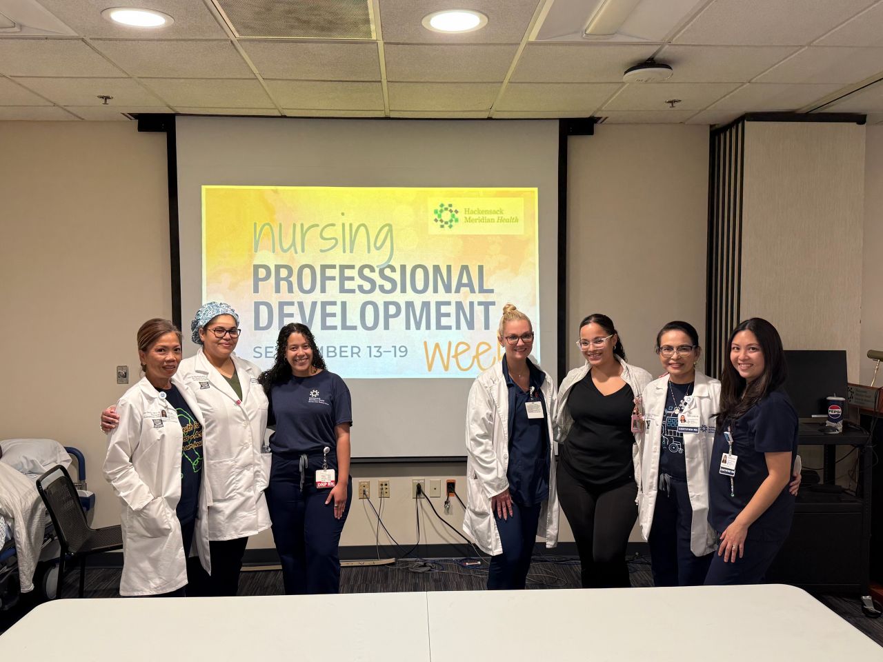 Group photo in front of NPD Week banner from Hackensack Meridian Health